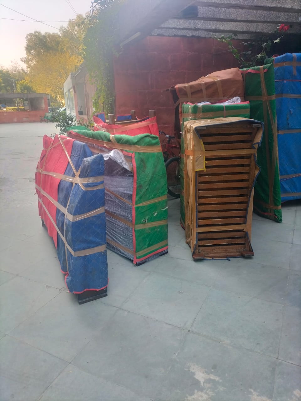 Securely packed household items wrapped with tarp